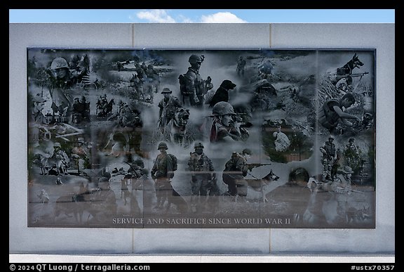 Mural with etched images of action during World War II, the Korean War, the Vietnam War, and Middle East wars, Military Working Dog Teams National Monument. San Antonio, Texas, USA (color)