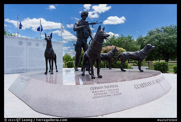Granite pedestal with bronze statues, and history wall. Military Working Dog Teams National Monument. San Antonio, Texas, USA (color)