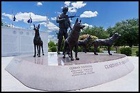 Granite pedestal with bronze statues, and history wall. Military Working Dog Teams National Monument. San Antonio, Texas, USA ( color)