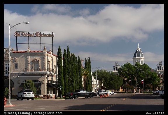 Downtown with Hotel Saint George and Presidio County Courthouse dome, Marfa. Texas, USA (color)