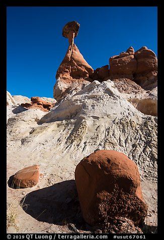 Rock and capped sandstone spire. Grand Staircase Escalante National Monument, Utah, USA