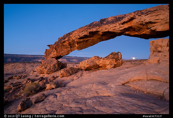 Sunset Arch with setting moon. Grand Staircase Escalante National Monument, Utah, USA
