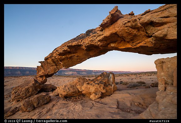 Slender and jagged Sunset Arch and the Straight Cliffs, sunrise. Grand Staircase Escalante National Monument, Utah, USA (color)