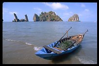 Boat and limestone towers, undeveloped beach, Hon Chong peninsula