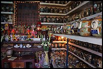 Temple room containing funeral urns with ashes of the deceased. Ho Chi Minh City, Vietnam
