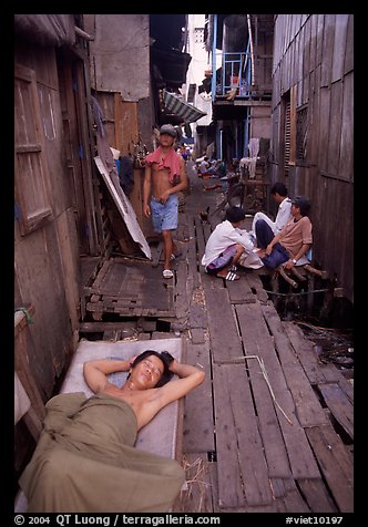 Sleeping late in a narrow alley. Ho Chi Minh City, Vietnam (color)