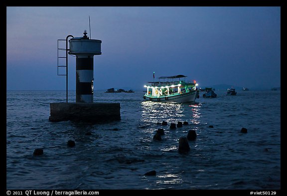 Lighted boat a dusk. Phu Quoc Island, Vietnam