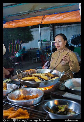 Woman preparing food, Dinh Cau Night Market. Phu Quoc Island, Vietnam