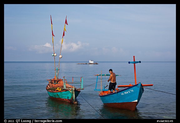 Fisherman on skiff. Phu Quoc Island, Vietnam (color)