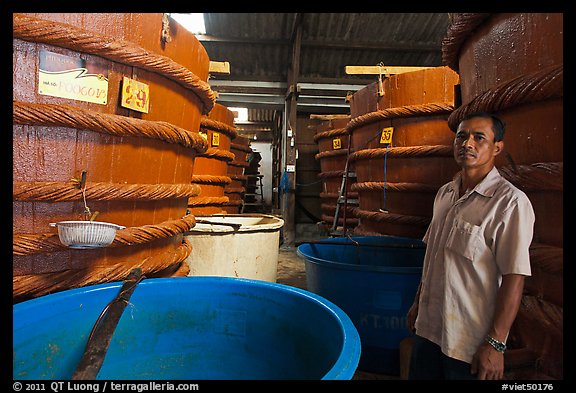Worker in fish sauch factory, Duong Dong. Phu Quoc Island, Vietnam