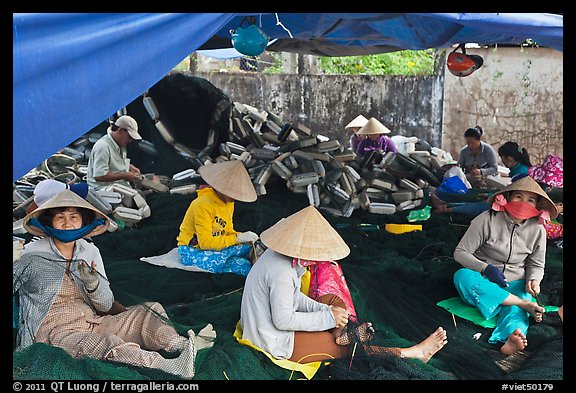 Women mending fishing nets, Duong Dong. Phu Quoc Island, Vietnam