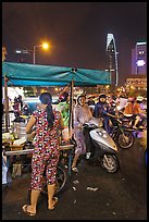 Street food stand at night. Ho Chi Minh City, Vietnam (color)