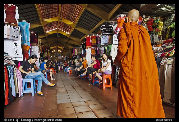 Buddhist Monk walking into Ben Thanh Market. Ho Chi Minh City, Vietnam (color)