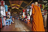 Buddhist Monk walking into Ben Thanh Market. Ho Chi Minh City, Vietnam (color)