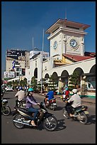 Chaotic motorcycle traffic outside Ben Thanh Market. Ho Chi Minh City, Vietnam (color)