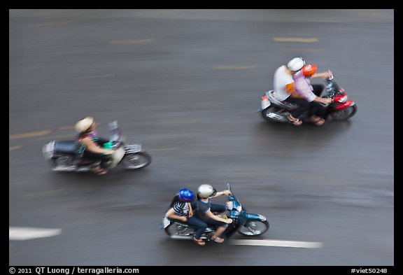 Motorbike riders seen from above with speed blur. Ho Chi Minh City, Vietnam (color)