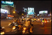 Moving traffic at night on traffic circle. Ho Chi Minh City, Vietnam (color)