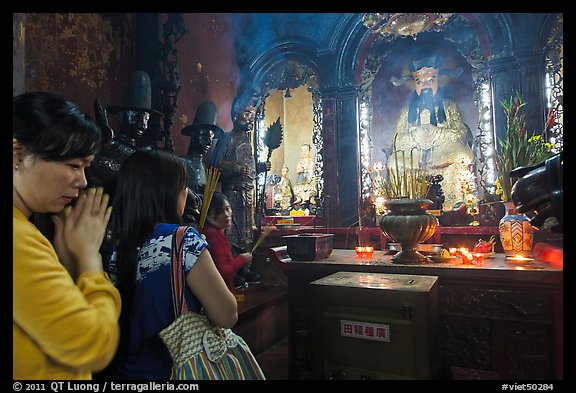 Women worshipping Thang Hoang, Phuoc Hai Tu pagoda, district 3. Ho Chi Minh City, Vietnam