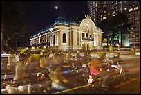 Motorcycles and Opera House at night. Ho Chi Minh City, Vietnam