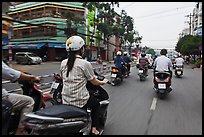 Motorcycle traffic seen from the street. Ho Chi Minh City, Vietnam (color)