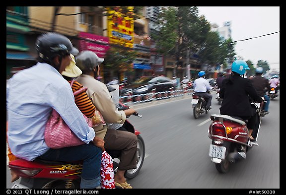 Motorcycle traffic seen from a motorcyle in motion. Ho Chi Minh City, Vietnam