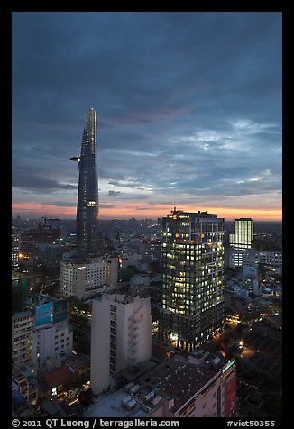 Bitexco Tower and city lights at sunset. Ho Chi Minh City, Vietnam