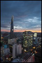 Bitexco Tower and city lights at sunset. Ho Chi Minh City, Vietnam ( color)