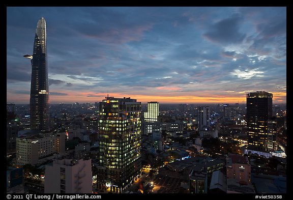 Bitexco Tower and city skyline at sunset. Ho Chi Minh City, Vietnam