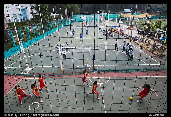 Stadium with girls team athetics, Van Hoa Park. Ho Chi Minh City, Vietnam (color)