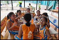 Girls athetics team eating, Cong Vien Van Hoa Park. Ho Chi Minh City, Vietnam (color)
