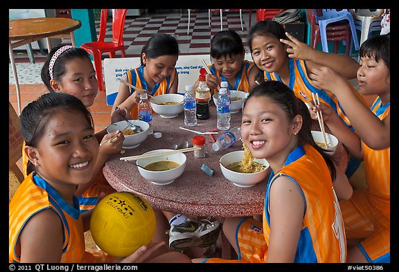 Girls sports team eating, Van Hoa Park. Ho Chi Minh City, Vietnam