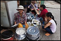 Woman offering soft tofu on the street. Ho Chi Minh City, Vietnam (color)