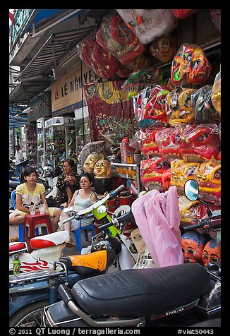 Store selling traditional dragon masks. Cholon, Ho Chi Minh City, Vietnam