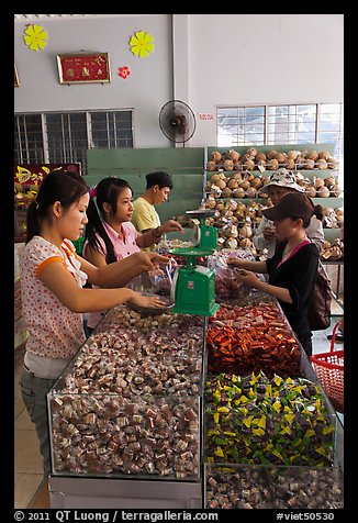 Women packing coconut candy for sale, Ben Tre. Mekong Delta region, Vietnam