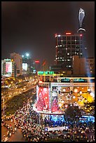 Cityscape elevated view at night with dense traffic on streets. Ho Chi Minh City, Vietnam (color)