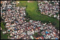 Aerial view of houses and fields on the outskirts of the city. Ho Chi Minh City, Vietnam ( color)