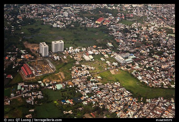 Aerial view of houses and high-rises on the outskirts of the city. Ho Chi Minh City, Vietnam