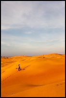 Sand dune landscape with figure. Mui Ne, Vietnam (color)