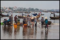 Fishing activity reflected on wet beach. Mui Ne, Vietnam ( color)