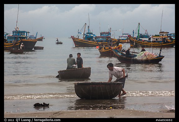 Fishermen on roundboats and fishing fleet. Mui Ne, Vietnam