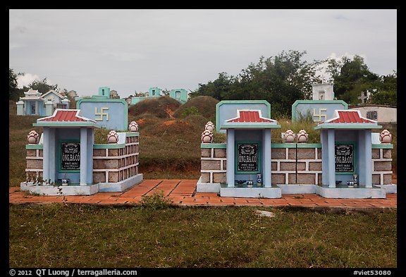 Mix of Buddhist and Christian tombs. Mui Ne, Vietnam (color)