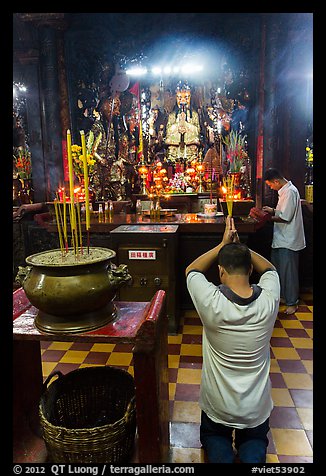 Worshippers inside Jade Emperor Pagoda. Ho Chi Minh City, Vietnam (color)