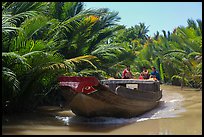 Boat navigating narrow waterway, Phoenix Island. Mekong Delta, Vietnam ( color)