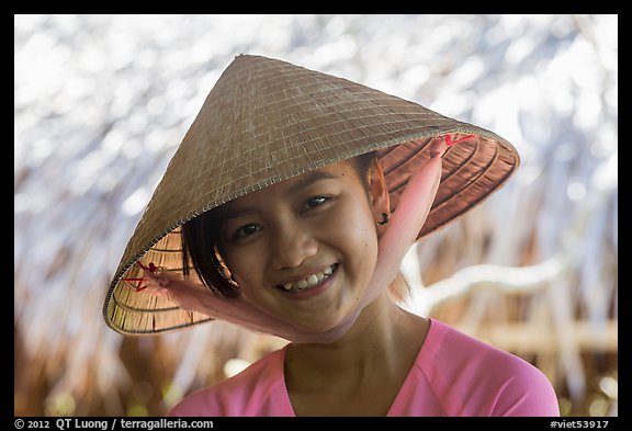 Portrait of girl with conical hat, Phoenix Island. My Tho, Vietnam
