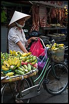 Woman selling bananas from bicycle. Ho Chi Minh City, Vietnam ( color)
