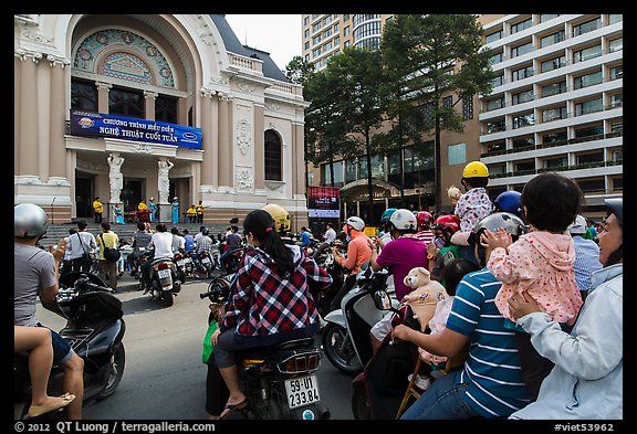 Families gather on moterbikes to watch musical performance. Ho Chi Minh City, Vietnam