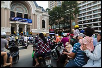 Families gather on moterbikes to watch musical performance. Ho Chi Minh City, Vietnam (color)