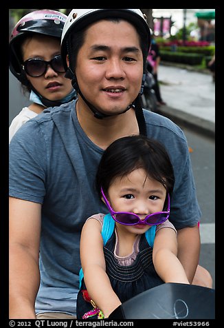 Family on motorbike with sunglasses. Ho Chi Minh City, Vietnam