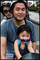 Family on motorbike with sunglasses. Ho Chi Minh City, Vietnam ( color)