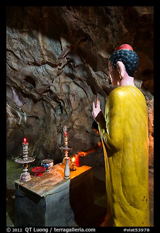 Buddha statue in narrow cave, Marble Mountains. Da Nang, Vietnam (color)
